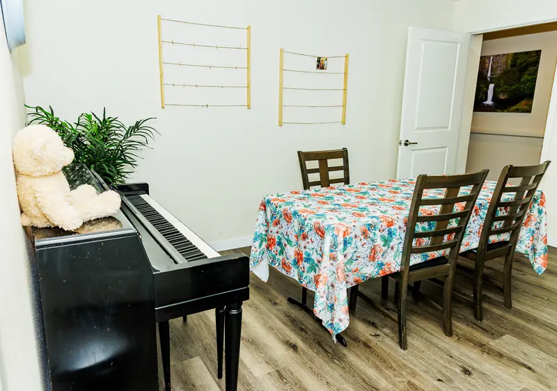 Activity room with piano at Fountain Assisted Living, Mesa AZ
