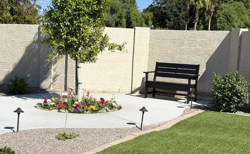 Garden bench beside flowers