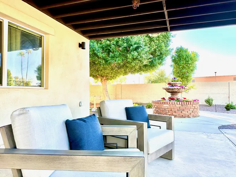 Covered patios in the Fountain Assisted Living backyard
